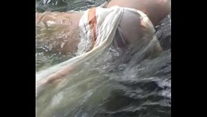 Gay couple fucking bareback in water